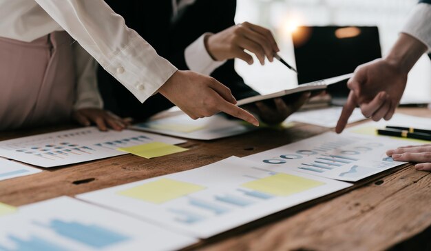 Business team meeting discussing company growth project success financial statistics professional investor working start up project for strategy plan with document