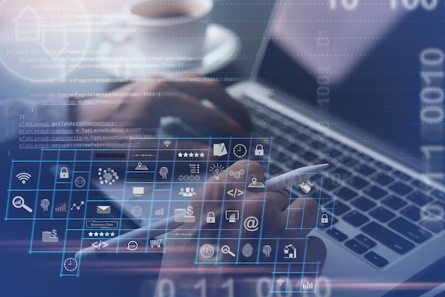 Businessman coding programmer software developer work on digital diagram via laptop with computer code technology icons binary on virtual screen