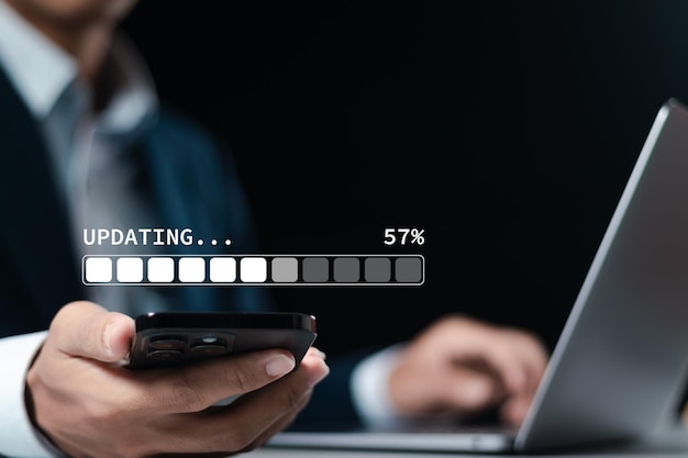 Businessman downloading and installing update process Software updates or operating system upgrades to keep your device up to date with enhanced functionality in new versions and improved security