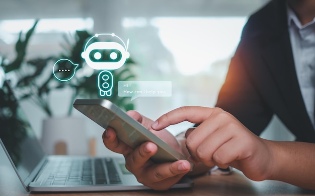 Businessman hand use show a smartphone to type live chat ask answer with an artificial intelligence system chatbot Ai assistant
