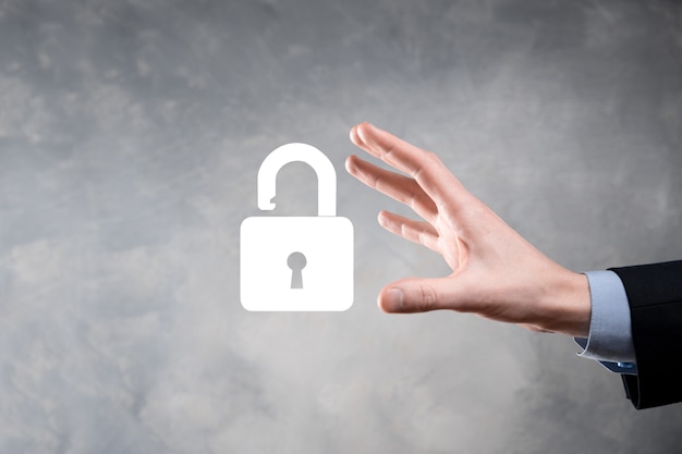 Businessman holds an open padlock icon on his palm.unlocking a virtual lock.