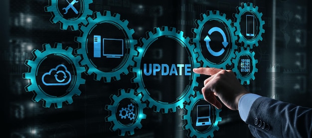 Businessman is pressing on the virtual screen Update Software Computer