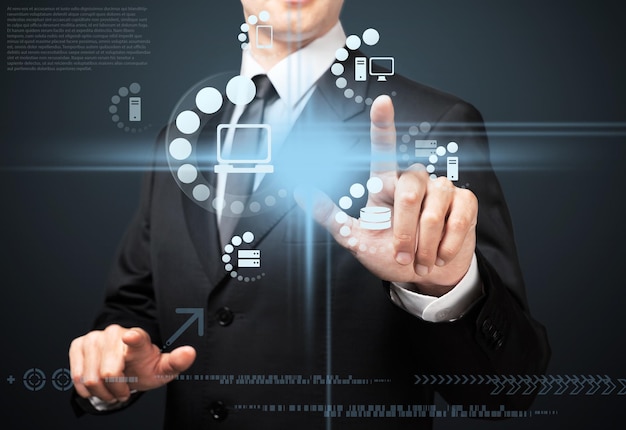 Businessman pressing multimedia type of modern buttons with virtual background