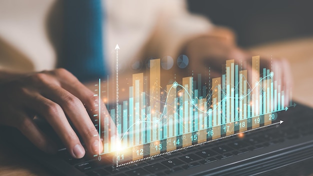 Businessman reading graph report and business statistics charts Analysis and improvemen