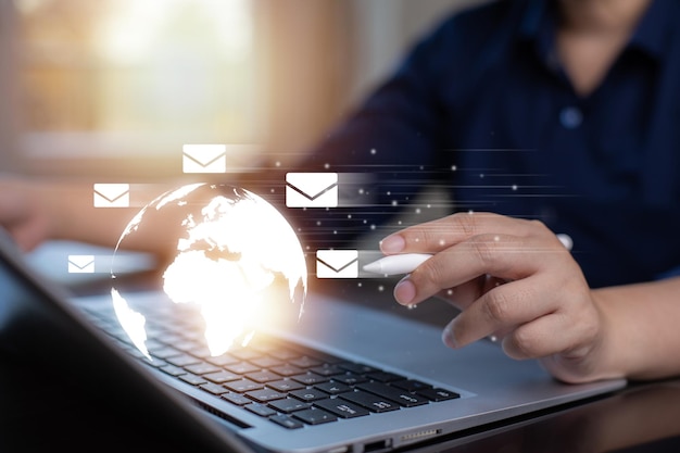 businessman sending email by laptop computer to customer business contact and communication email address email marketing concept newsletter online work internet network