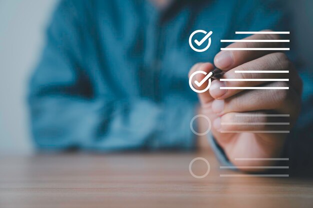 Businessman use pen to tick correct sign mark for document approve concept