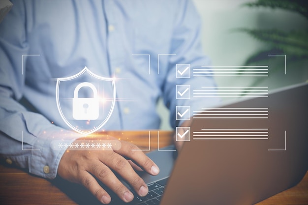 Businessman uses a laptop login password for identification protect privacy for security Technology system on security in the future Technology protect of private concept