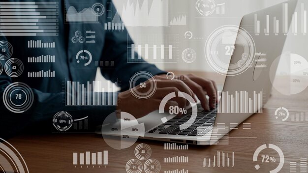 Businessman uses capable laptop computer to analyze business data analytic
