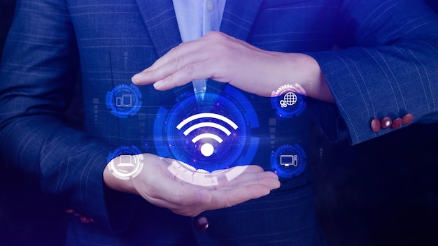Businessman using holding with wifi icon Social network business communication concept Wifi wireless concept free network Internet concept