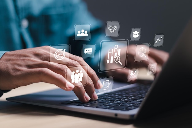 Businessman using laptop with virtual document management system for online document database and automated processes in file management Search and manage document database files online