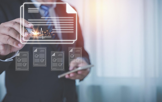Businessman wearing suits use a pen to sign electronic signature digital documents of paperless with copy space Paperless digital document electronic signature concept