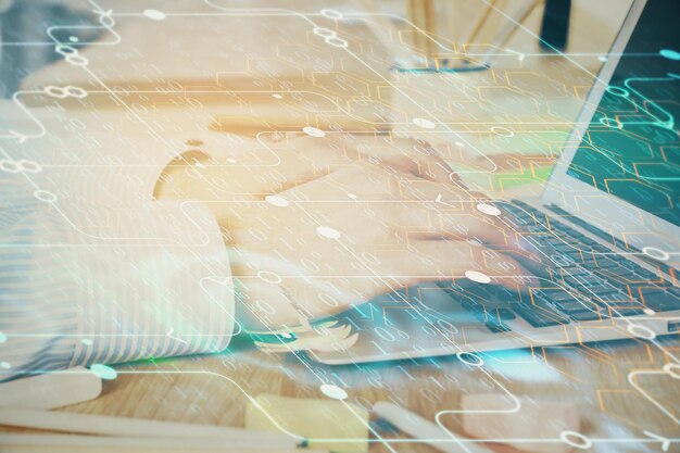 Businessman working on Laptop with technology theme drawing Concept of big data Double exposure