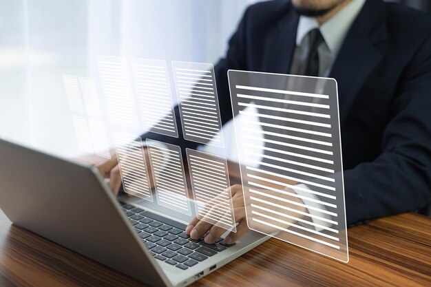 Businessman working on Paperless workplace electronic file in document management concept