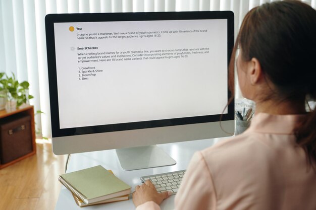 Businesswoman reading information on computer