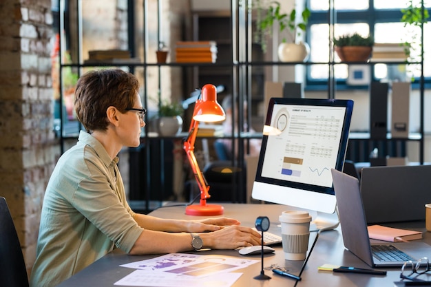 Businesswoman working with statistics on computer