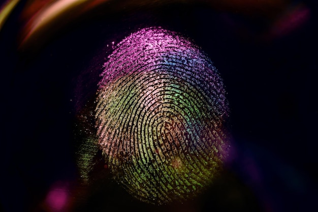 Close up beautiful abstract neon colored fingerprint on background texture for design Macro photog