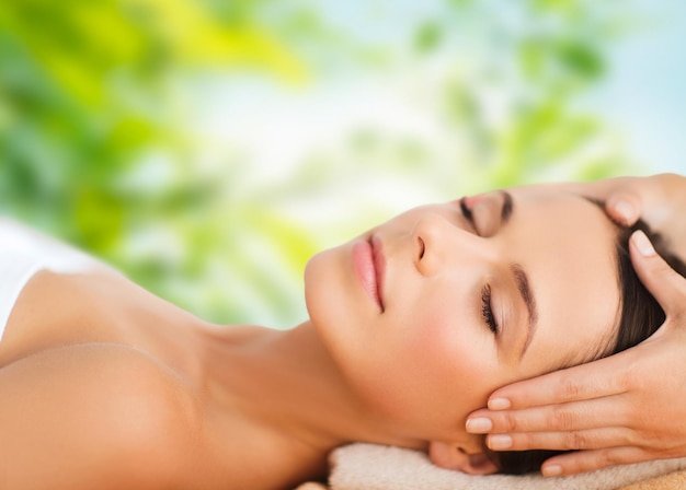 close up of beautiful woman having face massage