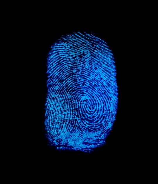 Close-up of fingerprint against black background