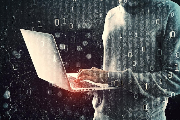 Close up of hacker hands using laptop while standing on abstract dark hacking background with bokeh circles and binary coding Malware and phishing data theft concept