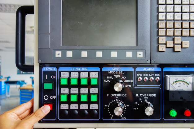 Close-up of hand using control panel