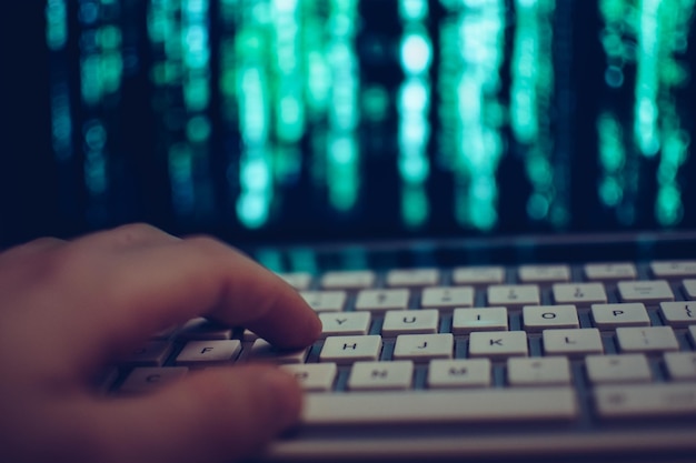 Close-up of hand using laptop
