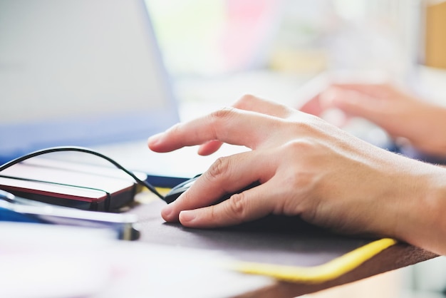Close-up of hands using computer