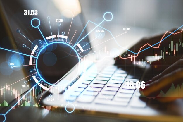 Close up of hands using laptop with abstract digital business forex chart Trade concept Double exposure