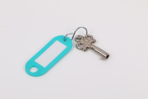 Close-up of key over white background