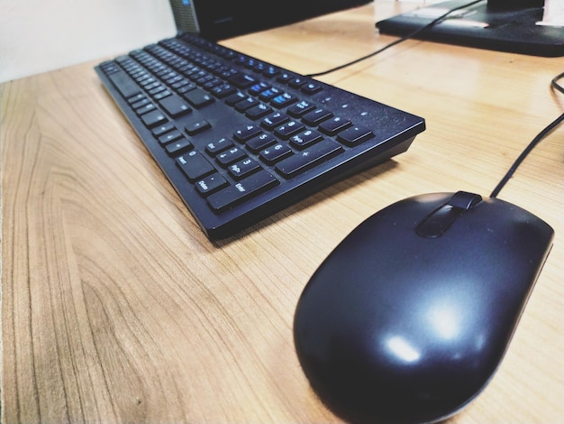 Close-up of keyboard and mouse on table