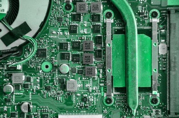 Close up of laptop processor with empty socket base for CPU and integrated graphics card on main board of notebook
