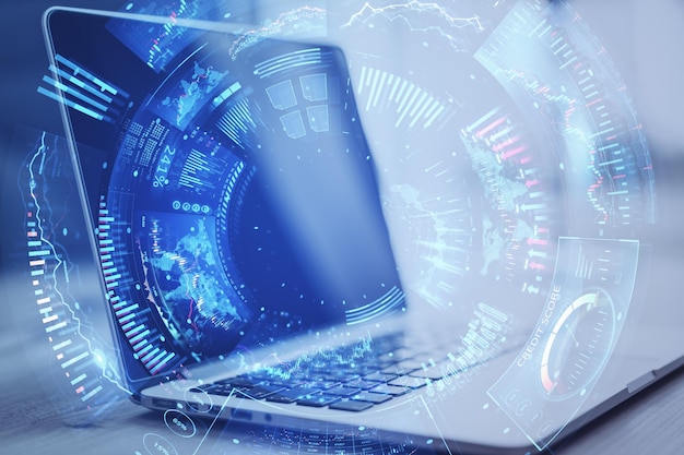 Close up of laptop with creative round digital business chart interface on blurry background Stock finance trade and technology concept Double exposure