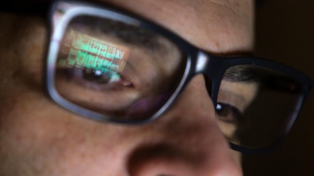 Close-up of man wearing eyeglasses