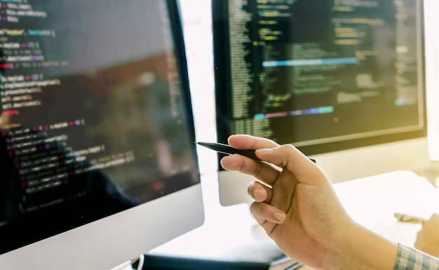 Close-up of software developer working on table