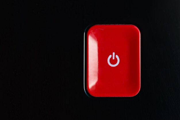 Close-up of stop sign against black background