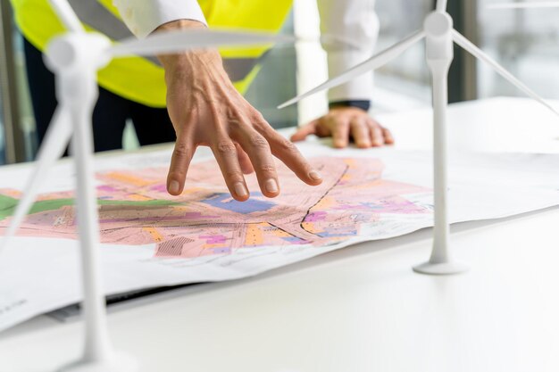 Close up picture of a table with a project plan on it