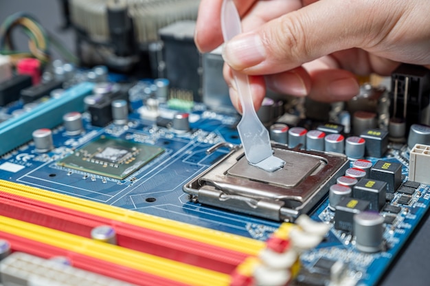 Close-up Thermal compound on cpu chip in mainboard computer