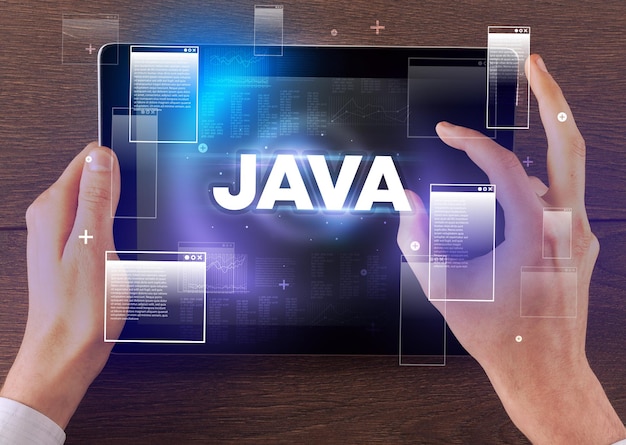 Closeup of a hand holding tablet