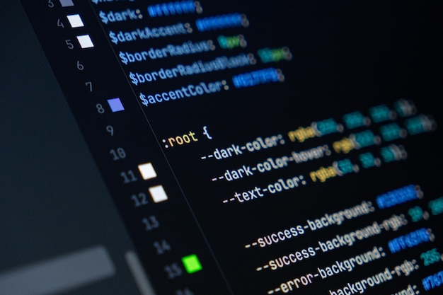 closeup of computer screen with colorful css code focus on root selector web development frontend design and programming