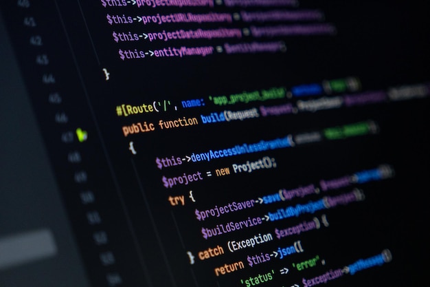 closeup of computer screen with colorful php code focus on route and function keywords backend development and programming
