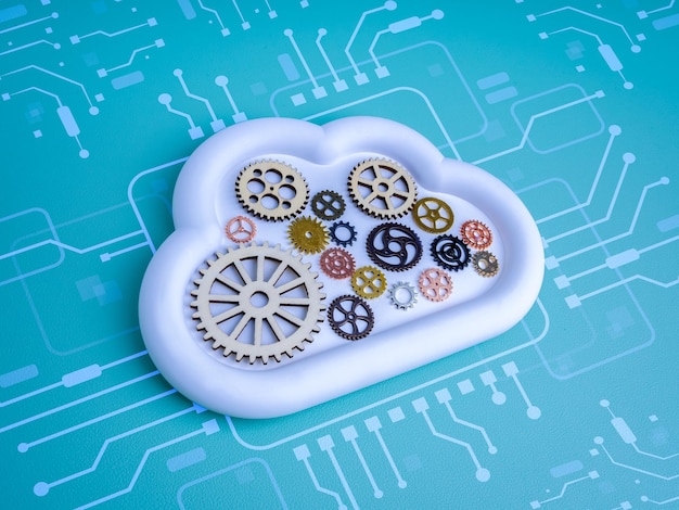 Cloud computing system concept with mechanical gears inside white cloud icon with circuit pattern symbolizing automation cloud technology management digital transformation and system integration