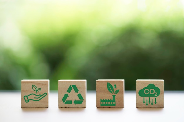 CO2 reducing Recycle Green factory icon on greenery background for decrease CO2 carbon footprint and carbon credit to limit global warming from climate change Bio Circular Green Economy concept