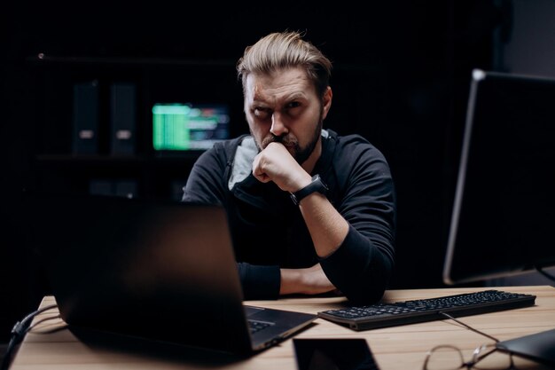 Computer hacker at dark room