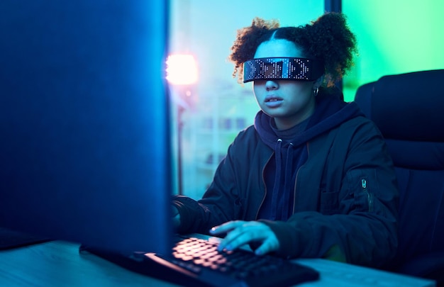 Computer hacker cyberpunk and neon girl hacking software online server or programming password phishing Blue ransomware developer cyber security glasses and night programmer coding malware code