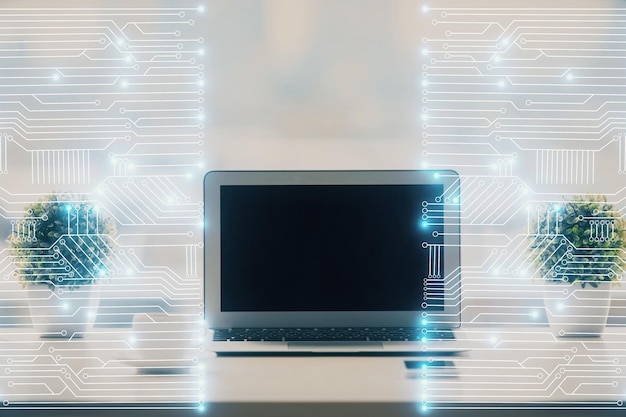 computer on desktop in office with technology theme hologram double exposure tech concept