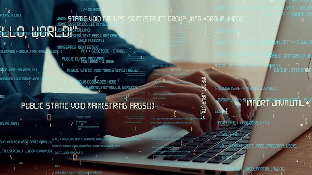 Computer programmer uses capable laptop computer to develop programming code