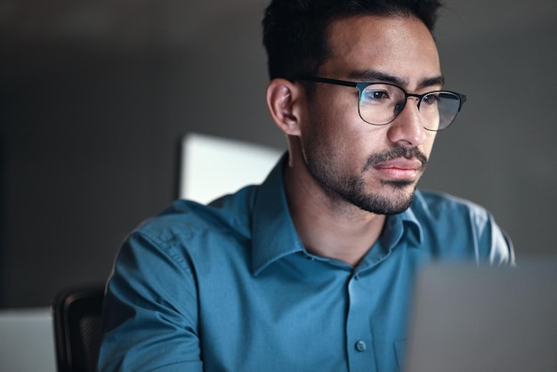 Computer research and business man or programmer for software development programming or cybersecurity Reading glasses and focus of IT person with data analysis system upgrade and coding online