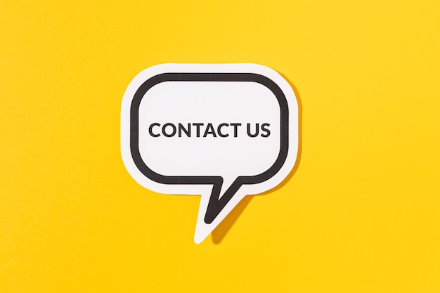 Contact Us text on speech bubble isolated on yellow background