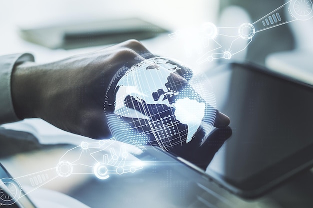 Creative concept of robotics technology with globe sketch and finger clicks on a digital tablet on background Robot development and automation concept Multiexposure