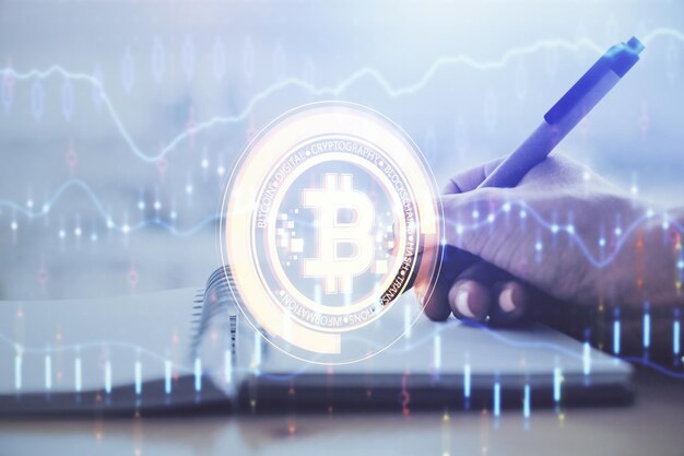 Cryptocurrency hologram over hands taking notes background Concept of blockchain Multi exposure