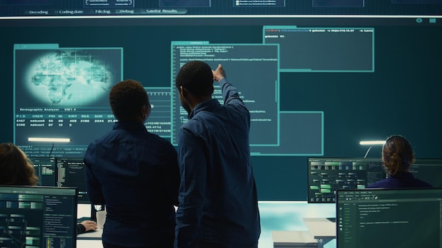 Cyber security team conducting cyber surveillance in governmental control room